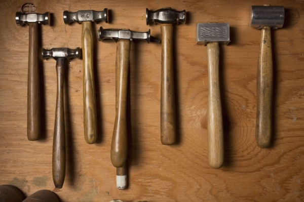 Collection of hammers lying on wood