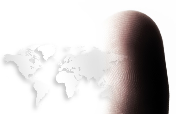 World map outline and human finger.