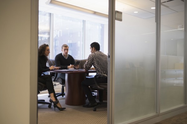Young business people having meeting in conference room.