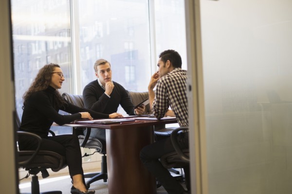 Young business people having meeting in conference room.