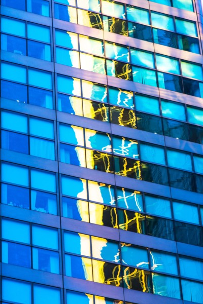 USA, New York, Distorted and blurred reflections in office building