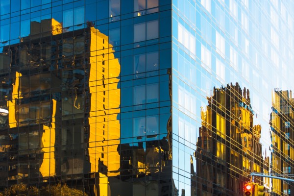 USA, New York, Glassy modern building in big city