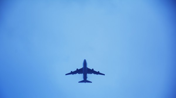 Airplane flying against clear sky