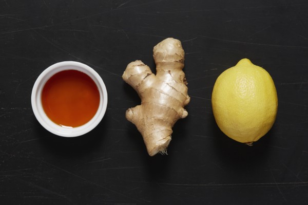 Bowl with honey, ginger and lemon