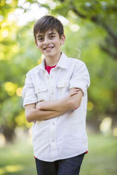 Boy standing and smiling