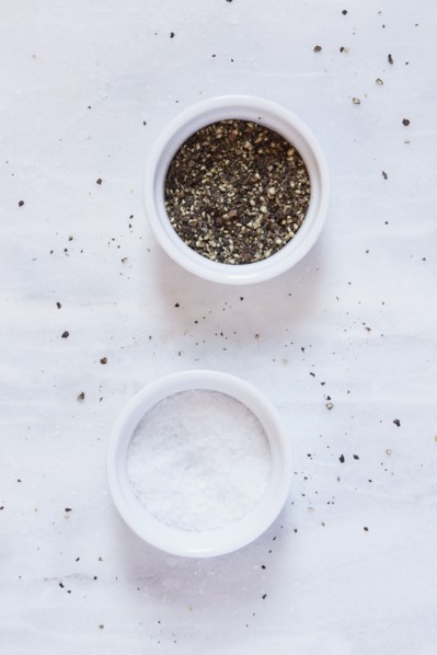 Salt and pepper on marble counter