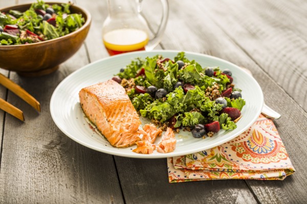 Salmon with salad on plate