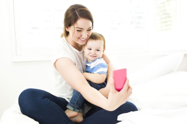 Mother taking selfie with son (4-5)
