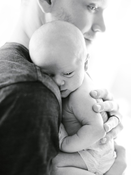 Portrait one day baby boy (0-1 months) being hold by his father