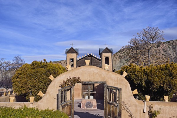 USA, New Mexico, Chimayo, El Santuario de Chimayo among trees and mountains