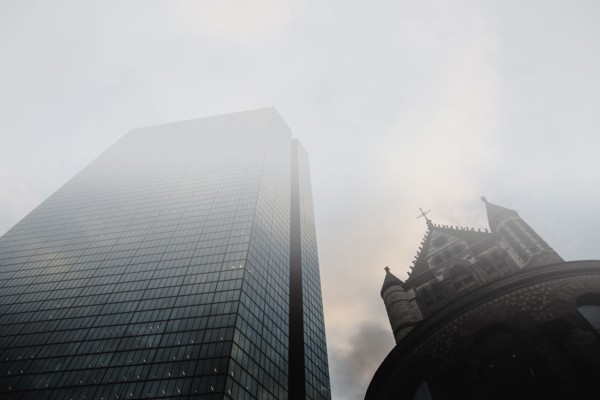 USA, Massachusetts, Boston, John Hancock Tower and Trinity Church at Copley Square in fog