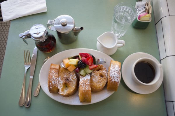 Plate with fresh french toasts and fruits