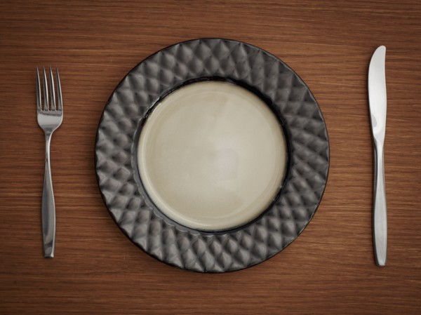 Studio shot of plate with fork and knife