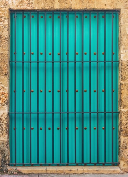 Cuba, Havana, Building exterior with turquoise shutters