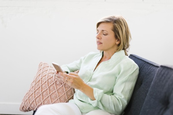 Mature woman using phone