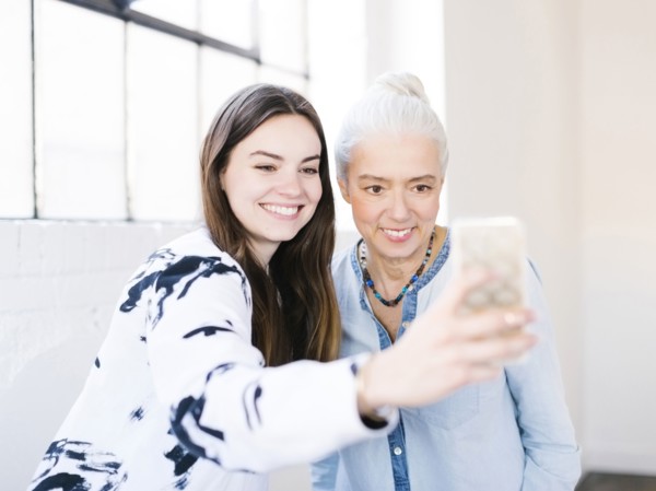 Daughter and mother making selfie