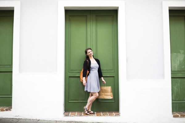 Puerto Rico, San Juan, Woman with shopping bag walking city streets