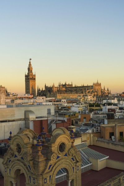 Spain, Seville, Cityscape with Cathedral of Seville at sunset