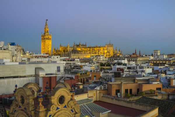Spain, Seville, Cityscape with Cathedral of Seville at sunset