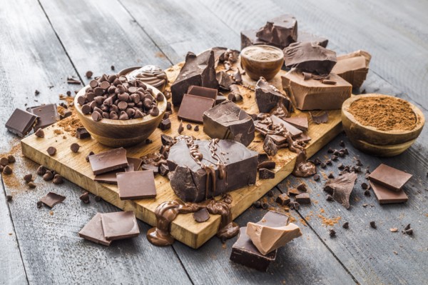 Various chocolate pieces on cutting board