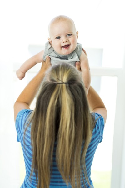 Mother playing with son (6-11 months)