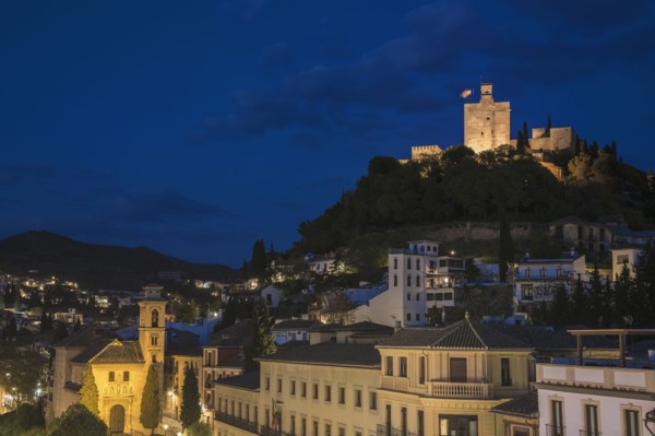 Spain, Andalusia, Granada, Plaza Nueva, Palace of Alhambra on hill at night