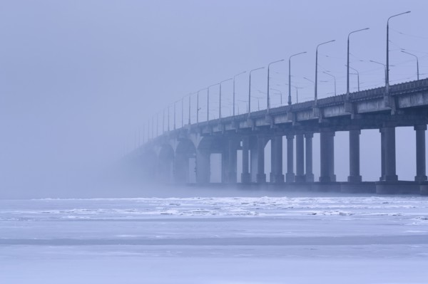 Ukraine, Dnepropetrovsk region, Dnepropetrovsk city, Bridge over frozen river