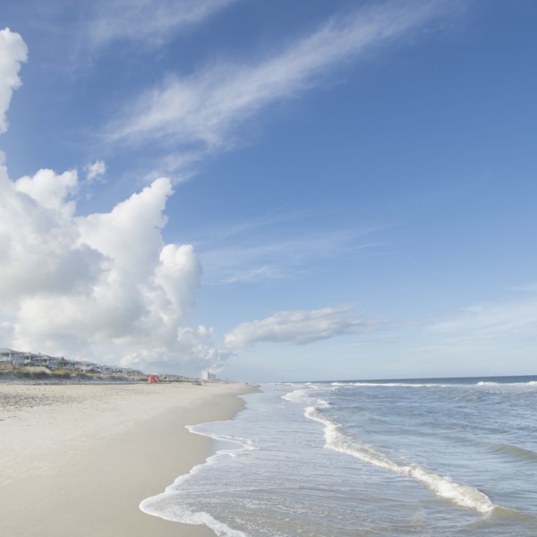 Clouds above beach and sea