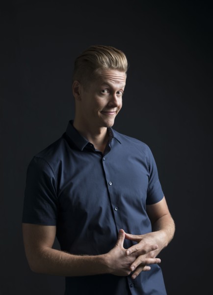 Portrait of man frowning and smiling