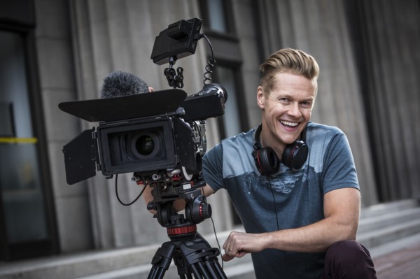 Portrait of smiling camera operator