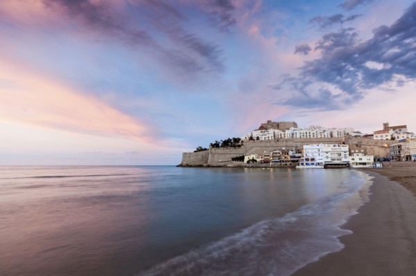 Spain, Valencian Community, Peniscola, Waterfront town at sunset