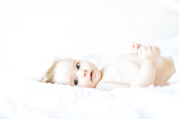 Portrait of baby girl (6-11 Months) looking at camera