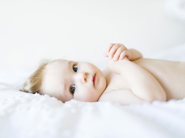 Portrait of baby girl (6-11 Months) looking at camera