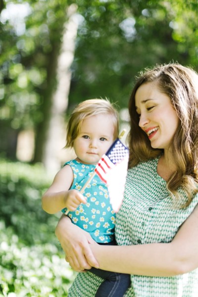 Portrait of mother and baby girl (12-17 months) in backyard