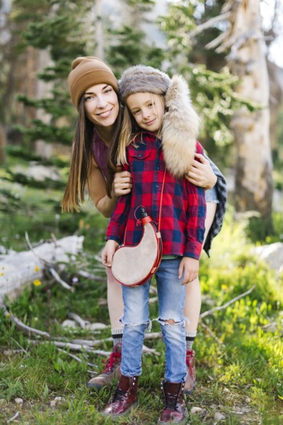 Portrait of mother with son (6-7) hiking in forest