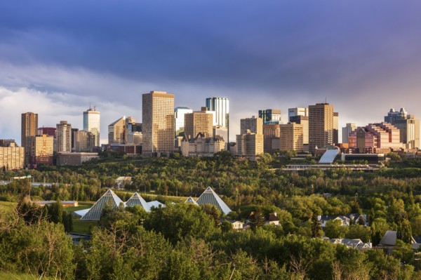 Canada, Alberta, Edmonton, Cityscape with trees in foreground