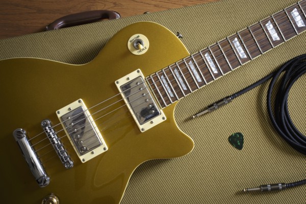 Gibson Les Paul and music equipment lying on guitar case