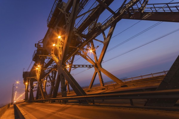 Ukraine, Dnepropetrovsk region, Dnepropetrovsk city, Illuminated bridge at dusk