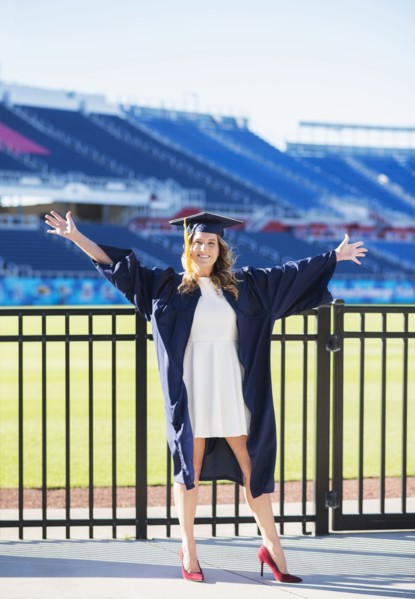 Portrait of graduate student in stadium