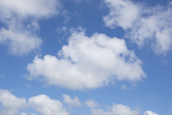 White cumulus clouds on blue sky