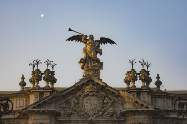 Spain, Seville, Statue of angel with trumpet