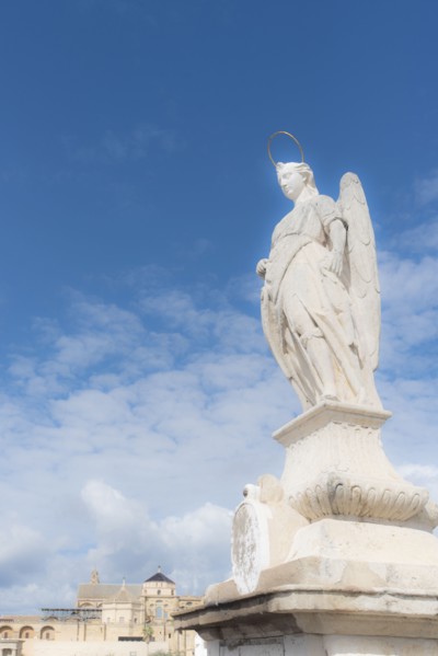 Spain, Andalusia, Cordoba, Statue of San Rafael against clouds