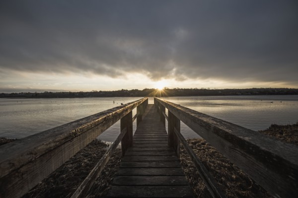 USA, Massachusetts, Eastham, Cape Cod, View from jetty on lake at sunrise