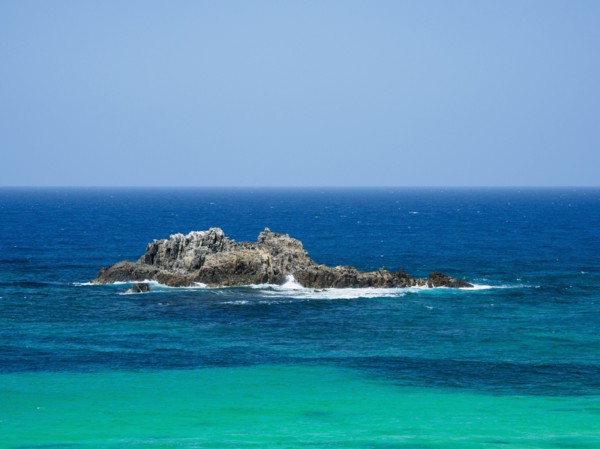 Australia, New South Wales, Bermagui, Wave splashing on rock formation in sea