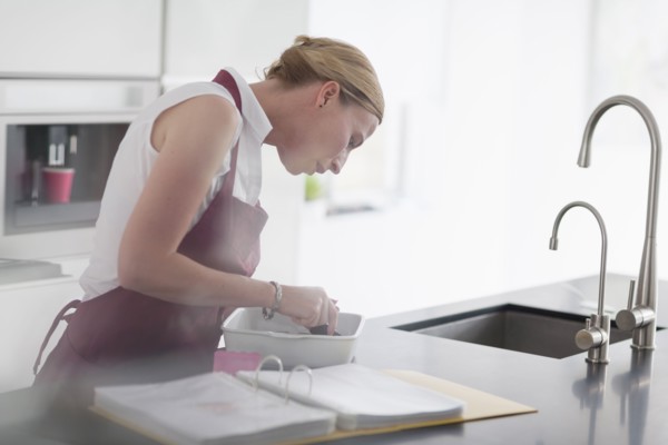 Woman preparing meal in kitchen