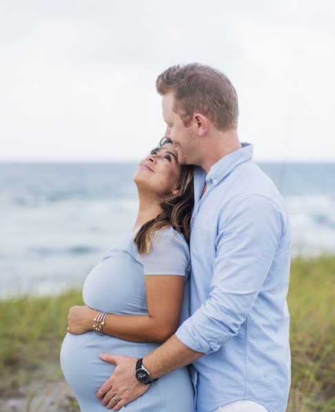 Pregnant couple embracing