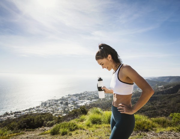 Woman in sportswear with water bottle