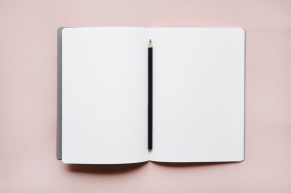 Pencil on open notebook