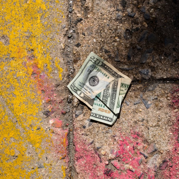 Crumpled money on sidewalk