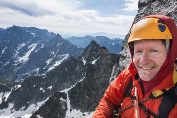 Mature man mountain climbing on Mount Stuart in North Cascade Mountains, Washington, USA